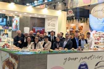 Emmi Desserts exhibition booth at SIGEP 2026 featuring a counter with displayed pastries and branded panels from Bontà Divina, Rachelli and Quadrifoglio, with a group standing behind the counter.